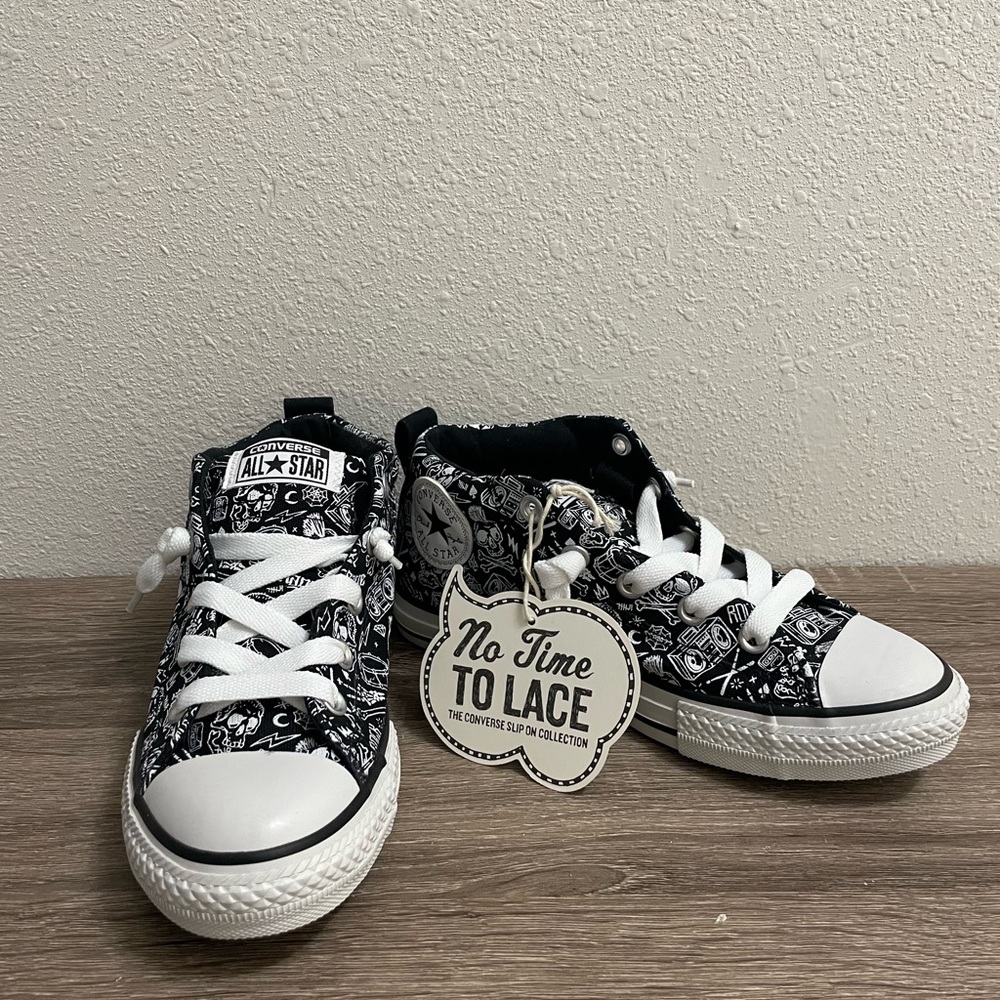 Converse Rock n Roll design high tops
Junior size